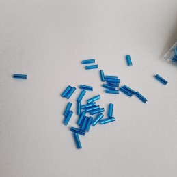 Abalorio Canutillo Azul turquesa oscuro 6 mm. Detalle rocalla